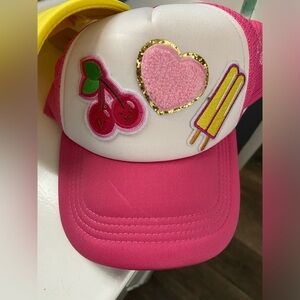 Trucker hat pink and white w patches on it summery